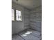 Bathroom with newly installed marble tile shower and window overlooking backyard area at 3325 Colby Chase Dr # 9, Apex, NC 27539