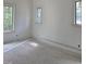 Unfinished room with newly installed window displaying a lush green outdoor landscape view at 3325 Colby Chase Dr # 9, Apex, NC 27539