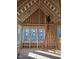Bright living room featuring large windows, natural light, and exposed beams being constructed at 3325 Colby Chase Dr # 9, Apex, NC 27539