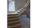 Under construction staircase highlighting the stairwell with a window on the landing at 3325 Colby Chase Dr # 9, Apex, NC 27539
