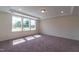 Well-lit bedroom with neutral carpeting and ample space at 6104 Sunset Lake Rd, Fuquay Varina, NC 27526