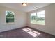 Spacious bedroom with neutral carpeting and large windows at 6104 Sunset Lake Rd, Fuquay Varina, NC 27526