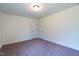 Empty bedroom with neutral walls and carpet at 6104 Sunset Lake Rd, Fuquay Varina, NC 27526