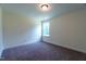 Simple bedroom with carpet and a window at 6104 Sunset Lake Rd, Fuquay Varina, NC 27526