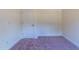 Small bedroom with carpet and a door at 6104 Sunset Lake Rd, Fuquay Varina, NC 27526