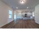 Open concept dining area with hardwood floors and kitchen views at 6104 Sunset Lake Rd, Fuquay Varina, NC 27526