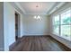 Spacious dining area featuring hardwood floors and a chandelier at 6104 Sunset Lake Rd, Fuquay Varina, NC 27526