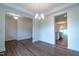 Luminous dining area with hardwood floors and access to kitchen at 6104 Sunset Lake Rd, Fuquay Varina, NC 27526