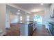 Open concept kitchen with granite countertops and stainless steel appliances at 6104 Sunset Lake Rd, Fuquay Varina, NC 27526