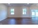 Spacious living room with hardwood floors and plenty of natural light at 6104 Sunset Lake Rd, Fuquay Varina, NC 27526