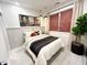 Serene bedroom with a comfortable bed, contemporary artwork, natural light, and sleek furnishings at 2117 Opulent Oaks Ln # 15, Durham, NC 27713
