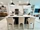 Bright kitchen features a spacious island with counter seating, stainless steel appliances and modern pendant lighting at 2117 Opulent Oaks Ln # 15, Durham, NC 27713