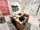 Bright office space with a large desk, stylish decor, and access to the upper level at 2117 Opulent Oaks Ln # 15, Durham, NC 27713