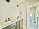 Bathroom features double sinks, modern faucets, and gray cabinets at 2613 Silver Gate Ct, Wake Forest, NC 27587