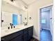 Modern bathroom with double sinks and contemporary fixtures at 2613 Silver Gate Ct, Wake Forest, NC 27587