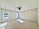 Spacious bedroom with carpet, a ceiling fan, and natural light from two windows at 2613 Silver Gate Ct, Wake Forest, NC 27587
