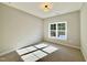 Cozy bedroom featuring a large window that provides ample natural light at 2613 Silver Gate Ct, Wake Forest, NC 27587