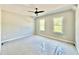 Bright bedroom with two large windows and a ceiling fan at 2613 Silver Gate Ct, Wake Forest, NC 27587