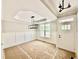 Unfinished dining room features a large window, modern light fixture, and classic wall trim at 2613 Silver Gate Ct, Wake Forest, NC 27587