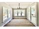 Bright dining area with large windows and sliding glass door offering serene outdoor views at 2613 Silver Gate Ct, Wake Forest, NC 27587
