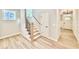 Entryway foyer with hardwood floors, a staircase, and natural light at 2613 Silver Gate Ct, Wake Forest, NC 27587