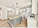 Spacious unfinished kitchen with a central island, white cabinetry and stainless steel appliances at 2613 Silver Gate Ct, Wake Forest, NC 27587