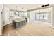 Spacious unfinished kitchen with a central island, white cabinetry and stainless steel appliances at 2613 Silver Gate Ct, Wake Forest, NC 27587