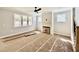 Comfortable living room area boasting lots of natural light from many windows and fireplace feature at 2613 Silver Gate Ct, Wake Forest, NC 27587