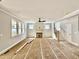 Spacious living room features a fireplace, many windows, and easy access to stairs at 2613 Silver Gate Ct, Wake Forest, NC 27587