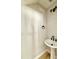 Contemporary powder room with pedestal sink, modern lighting, and black fixtures at 2613 Silver Gate Ct, Wake Forest, NC 27587