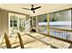 Covered and screened in back porch with ceiling fan and view of the backyard at 2613 Silver Gate Ct, Wake Forest, NC 27587