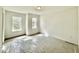 Bright bedroom featuring two windows, neutral walls, and modern recessed lighting at 2617 Silver Gate Ct, Wake Forest, NC 27587