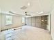 Primary bedroom with tray ceiling, a modern fan, and large windows at 2617 Silver Gate Ct, Wake Forest, NC 27587