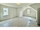 Spacious bedroom with two windows, recessed lighting, and a sloped ceiling at 2617 Silver Gate Ct, Wake Forest, NC 27587