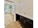 Built-in desk area featuring black cabinets with light countertops at 2617 Silver Gate Ct, Wake Forest, NC 27587
