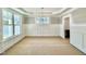 Bright dining room with wainscoting, chandelier and large windows at 2617 Silver Gate Ct, Wake Forest, NC 27587