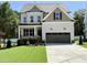 Charming two-story home featuring a well-manicured lawn and attached two-car garage at 2617 Silver Gate Ct, Wake Forest, NC 27587