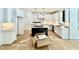 Modern kitchen with white cabinets, stainless steel appliances, and a black island at 2617 Silver Gate Ct, Wake Forest, NC 27587