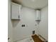 Compact laundry area with white cabinets and utility hookups at 2617 Silver Gate Ct, Wake Forest, NC 27587