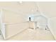 Well-lit loft area with a railing and access to additional rooms at 2617 Silver Gate Ct, Wake Forest, NC 27587