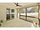 Relaxing screened porch with a ceiling fan and wooden floor at 2617 Silver Gate Ct, Wake Forest, NC 27587