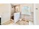 Walk-in shower with a window and tiled walls at 2617 Silver Gate Ct, Wake Forest, NC 27587