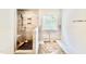 Walk-in shower featuring bench seating, and a tiled shower with a rain shower head at 2617 Silver Gate Ct, Wake Forest, NC 27587