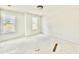 Bright bedroom with dual windows offering ample natural light, awaiting your personal touch at 2621 Silver Gate Ct, Wake Forest, NC 27587