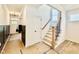 Inviting entryway showcases a staircase with iron spindles, a coat closet, and views to the home's front door at 2621 Silver Gate Ct, Wake Forest, NC 27587