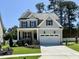 Charming two-story home with a well-manicured lawn and a classic American design at 2621 Silver Gate Ct, Wake Forest, NC 27587