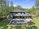 Aerial view of home showcasing the large yard, pool area, and wooded surroundings at 7640 Falls Creek Ln, Raleigh, NC 27614