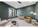 Spacious basement lounge with comfortable seating and large windows at 7640 Falls Creek Ln, Raleigh, NC 27614