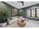 Relaxing lounge area with comfortable seating and large windows at 7640 Falls Creek Ln, Raleigh, NC 27614