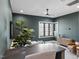 Cozy basement lounge featuring a sectional sofa and built-in bar at 7640 Falls Creek Ln, Raleigh, NC 27614
